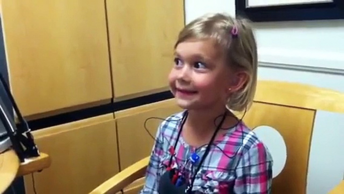 Little girl hearing hearing her own voice for the first time