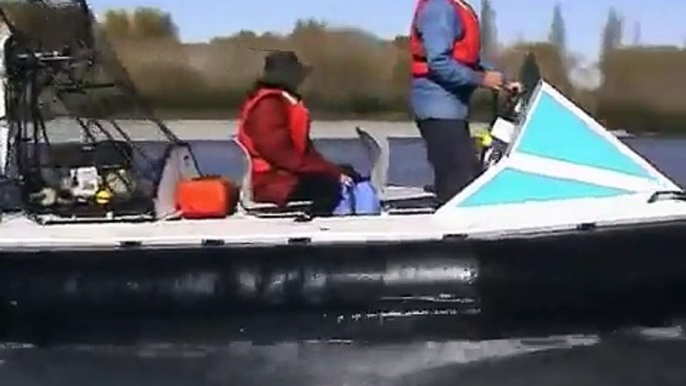 Hovercraft  on a stony river against the flow