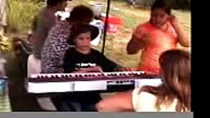 Blind child playing piano and singing "Listen To Your Heart"