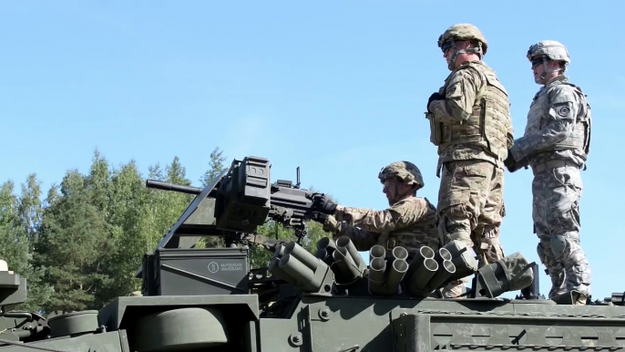 U.S Soldiers Firing  MK19 Grenade Launcher on Stryker