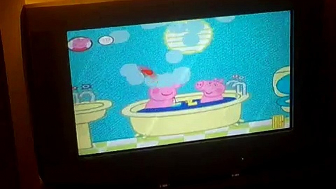 Max plays his new Peppa Pig game on the Wii