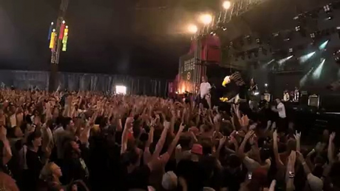 Singer Catches and Drinks Beer While Crowd Walking in Holland