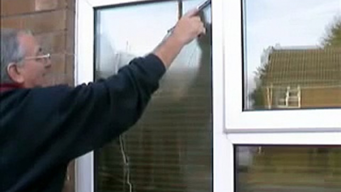 How to wash a window using a mop and squeegee