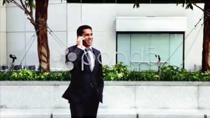 Handsome hispanic businessman talking at phone. Stock Footage