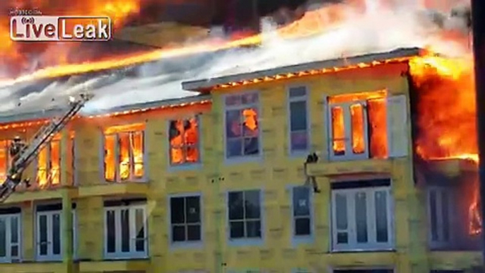 Man jumps from ledge to ledge of building on fire, building collapse!!
