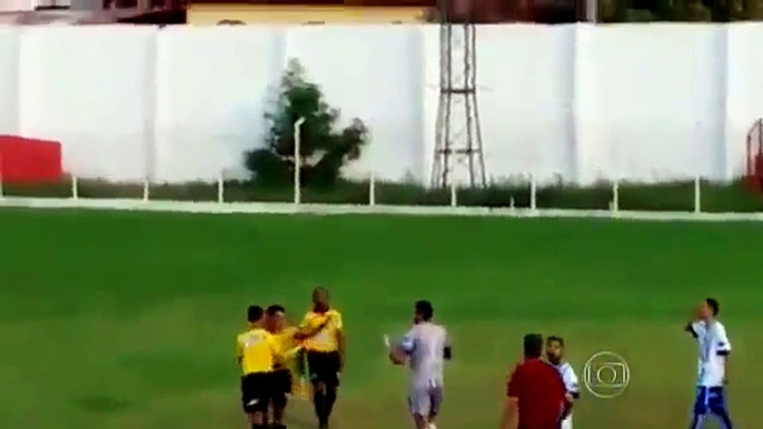 Referee pulls out Weapon a  during football match in BRAZIL (raw)