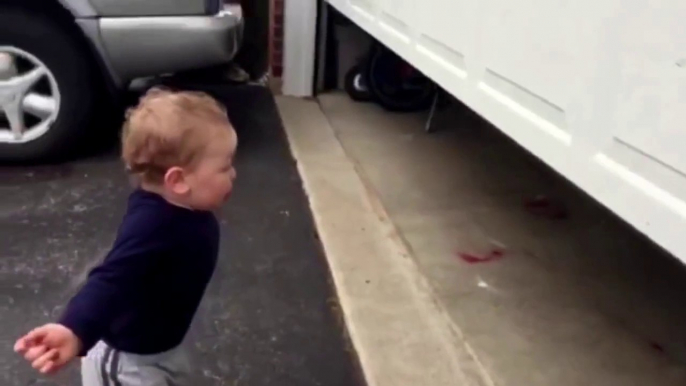 The reaction of the boy on automatic garage doors