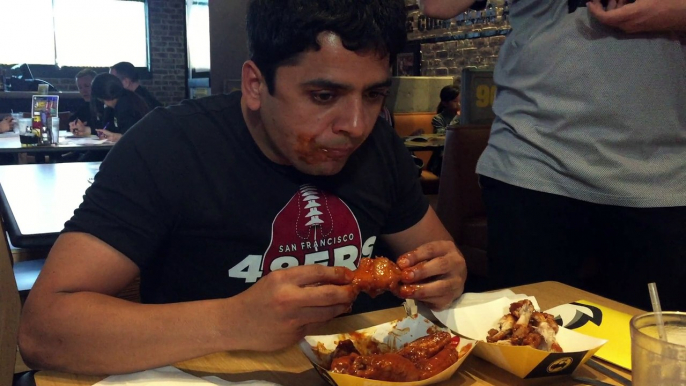 Pakistani guy winning the killing hot pepper chicken wings challenge in USA :)