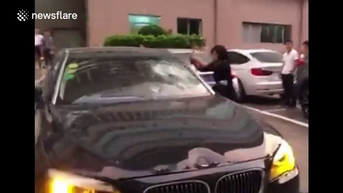 Wife angered by husband's alleged affair smashes £200,000 BMW with hammer