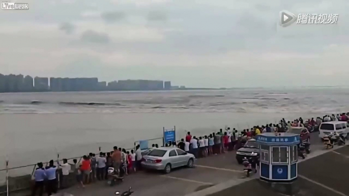 LiveLeak - Huge Wave Swept Away Several Vehicles and People in China