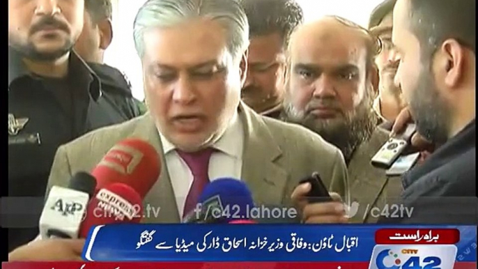 Finance Minister Ishaq Dar talking to media in Iqbal Town