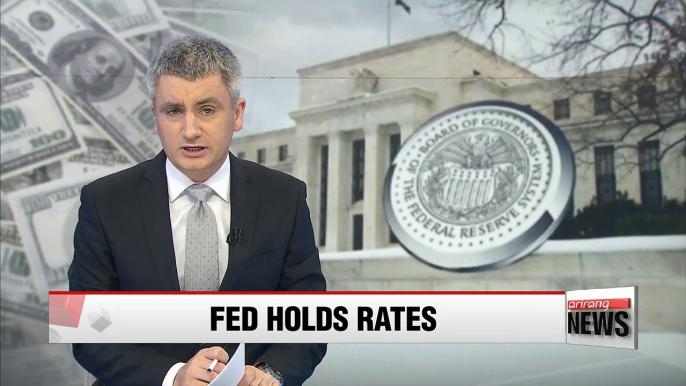 Fed keeps interest rates unchanged citing slower growth