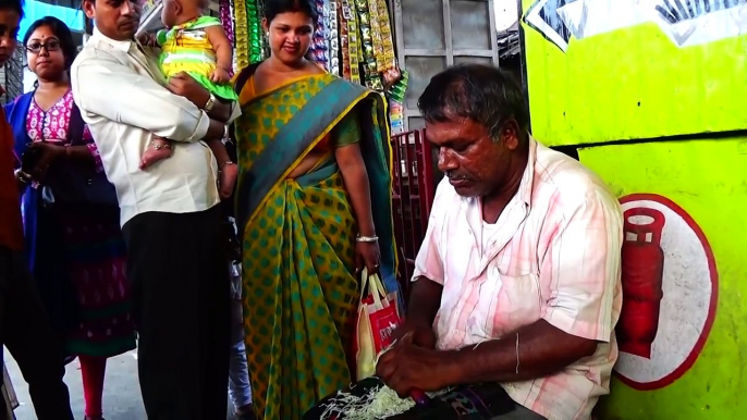 We recorded a salesman in kolkata Indian Railway Station an interesting Indian-made cutter that lets you slice, peel, chop and make vegetable designs too.