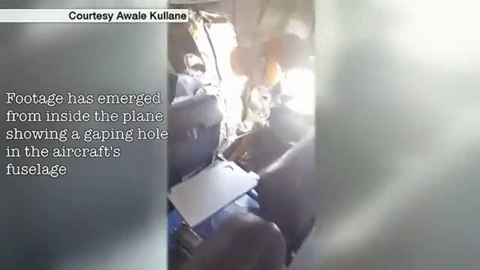 Video shows gaping hole in plane fuselage - BBC News (FULL HD)