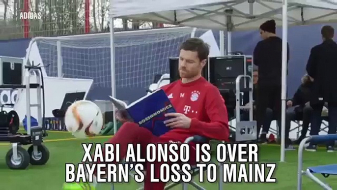 Xabi Alonso juggles Soccer Ball while reading