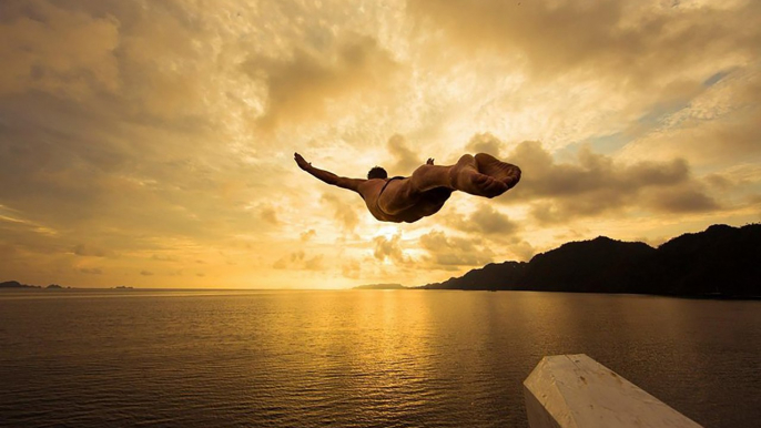 Cliff Diving Into Indonesian Paradise