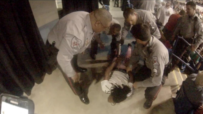 Protester Assaulted by Trump Supporter, Restrained by Police at North Carolina Rally