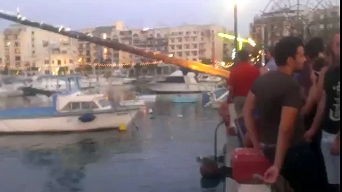 Ouch! Greasy pole climbing attempt ends between his legs