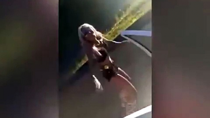 Blonde woman dancing on roadside causes car crash