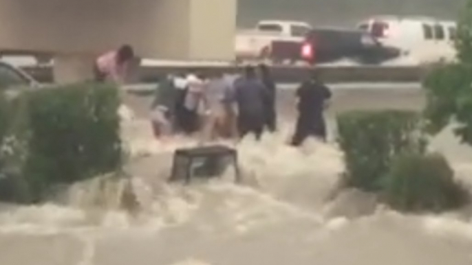 Woman Rescued From Van Surrounded by Powerful Floodwaters in Conroe