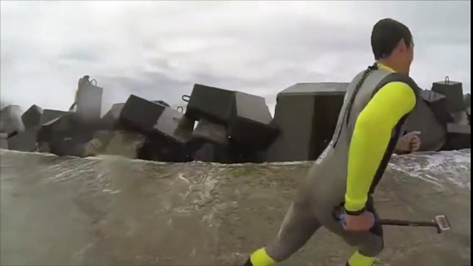 Huge Waves Hit Guys on Breakwater