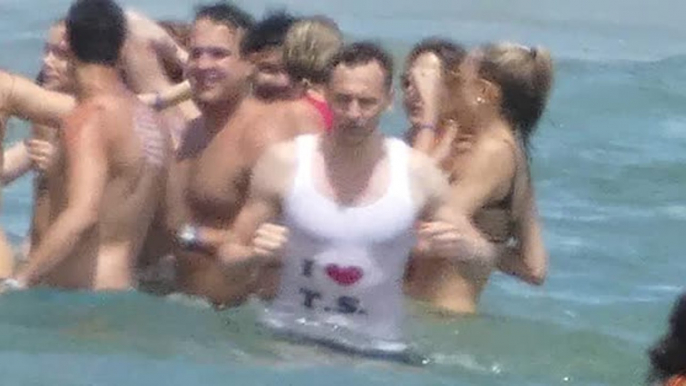 Why is Tom Hiddleston Wearing a 'I Heart Taylor Swift' Tank in the Ocean?