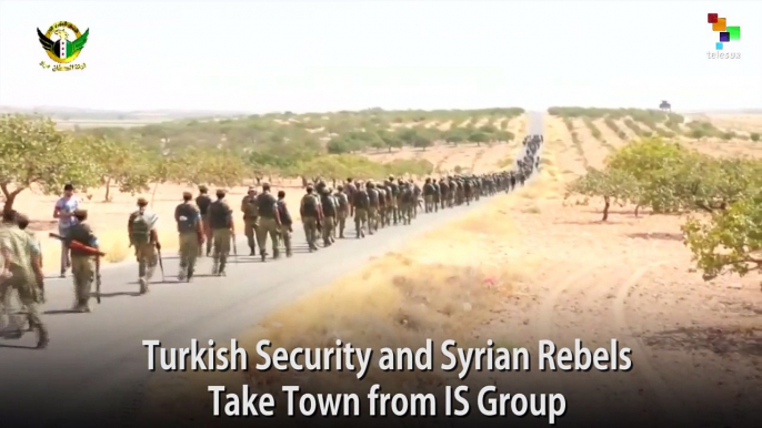 Turkish Security and Syrian Rebels Take Town from IS Group