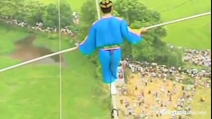 Acrobat falls off tight-rope in death defying high wire stunt gone wrong