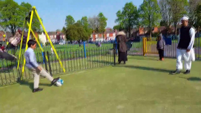 Digby Park in Birmingham.Football passing match ( Uncle & Nephew )