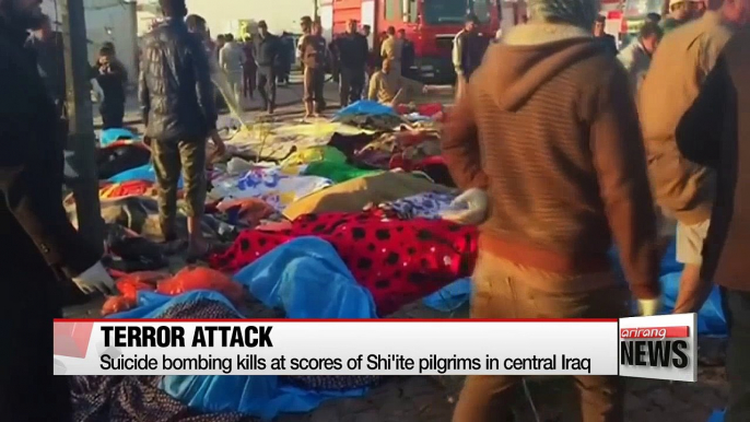 Suicide bombing kills at scores of Shi'ite pilgrims in central Iraq