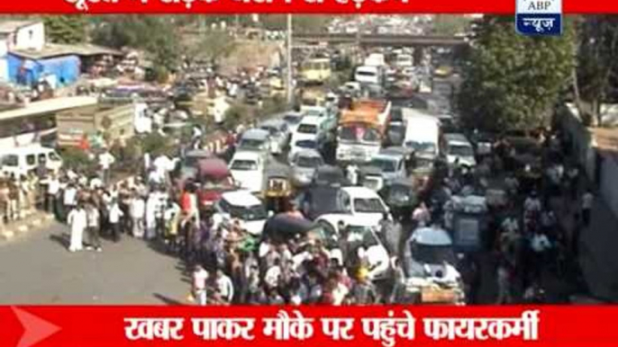 Cars damaged as part of a road caves in Surat