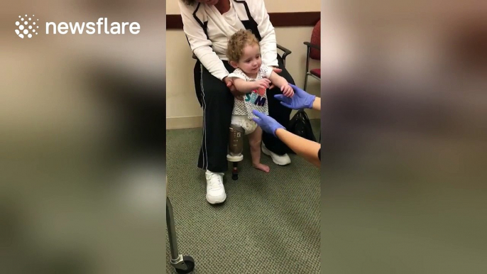 Twenty month old girl takes first steps with prosthetic leg