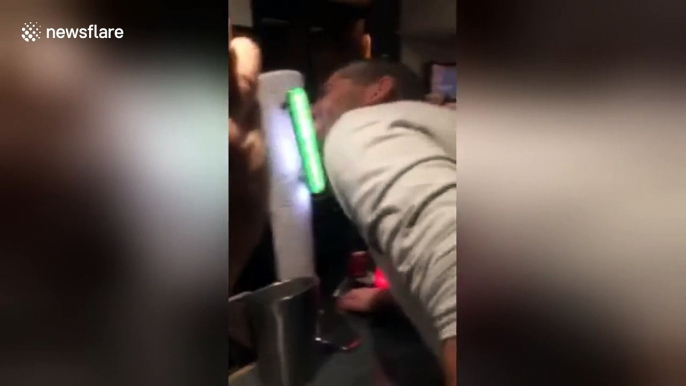 Man tries to lick beer pump and gets his tongue stuck