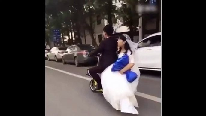 Wedding FAIL  Bride falls off the back of a scooter
