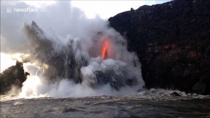 Incredible fire hose of lava flows from Kilauea volcano into the ocean