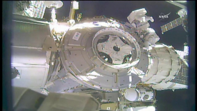 Shield Sails Away from Space Station During Spacewalk