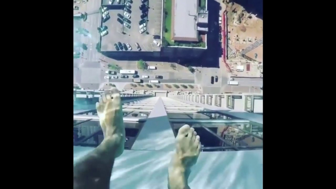 Pool Sky : Glass bottomed swimming pool on 42nd floor in the busy street 500 feet below in Houston