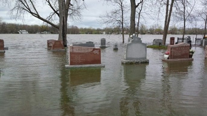 Church Graveyard Greeted by Rising Floodwaters Near Montreal