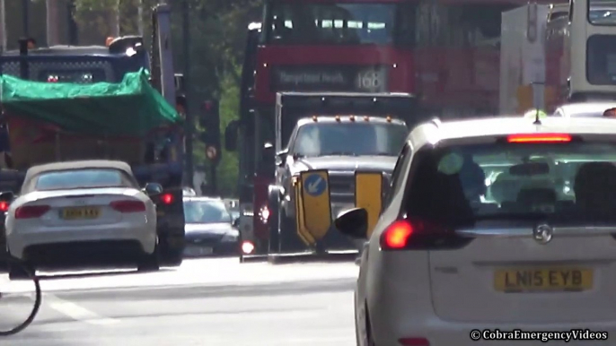 Heavy armored 'SWAT' police truck responding with siren an