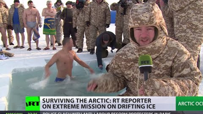 Russian troops plunge into icy water near North Pole during Arctic drill