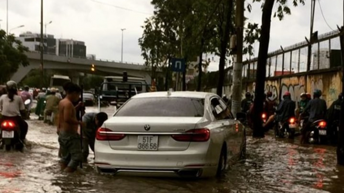 Motorists Negotiate Flooded Streets of Ho Chi Minh City