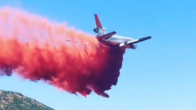 Plane drops retardant on Arizona fire as governor declares state of emergency