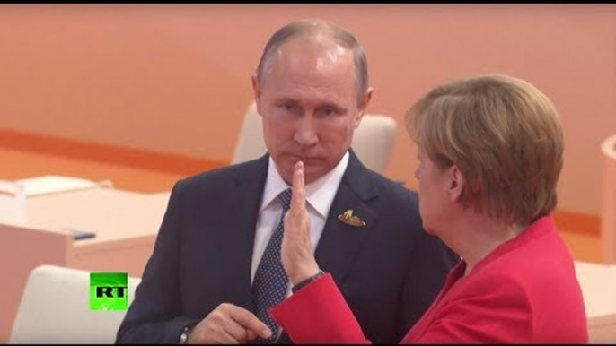 Can someone read lips? What are Merkel and Putin talking about at G20?