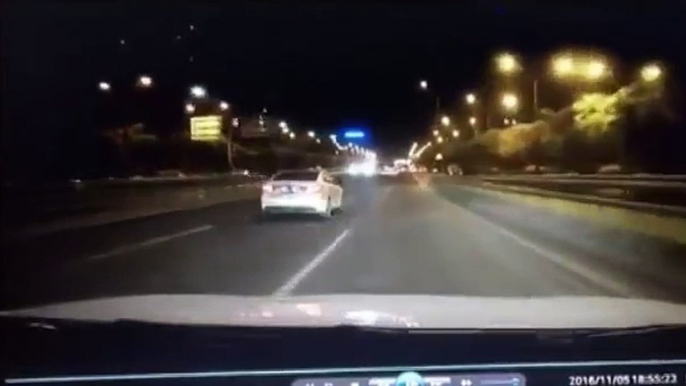 Car flung into the air by dark object on road