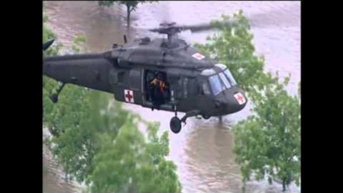 pilot saving two men drowning into flood from helicopter