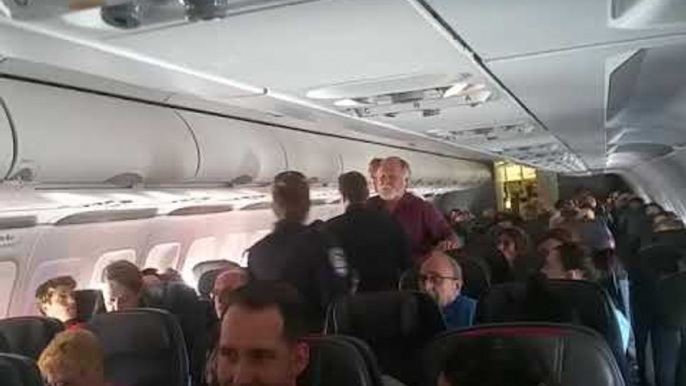 American Airlines Passenger Tries to Open Emergency Exit Door During Flight