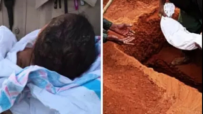 A new born baby pulled out alive from shallow grave