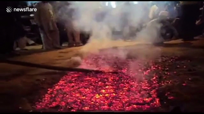 Shocking moment father places baby son on hot coals to fulfil religious vow