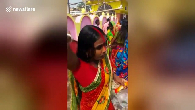 Indian women accidentally worship dustbin during major festival