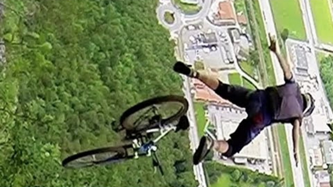 Downhill Mountain Biker Throws Himself Off A Cliff